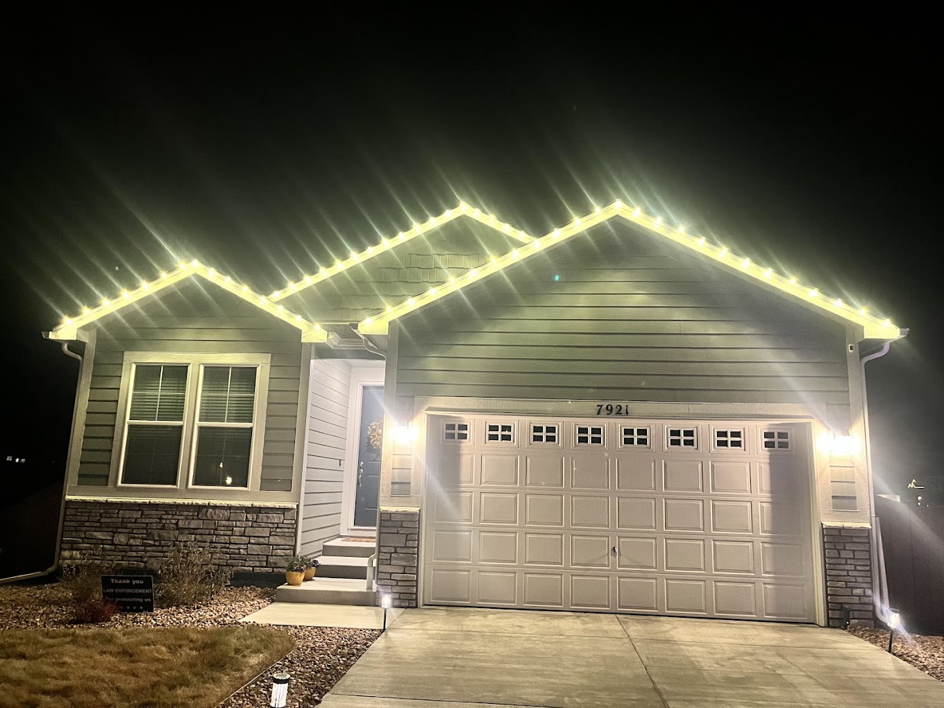Warm white roofline Christmas light installation on a Colorado Springs home by Christmas Lights Colorado Springs